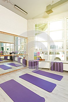 Empty space in fitness center, yoga mats