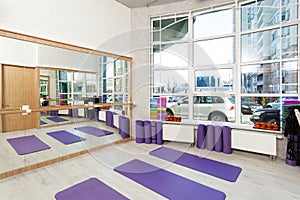 Empty space in fitness center, yoga mats