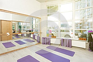 Empty space in fitness center, yoga mats