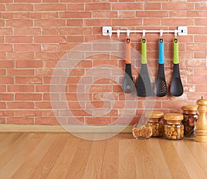 Empty space on the kitchen counter with utensils on hooks photo