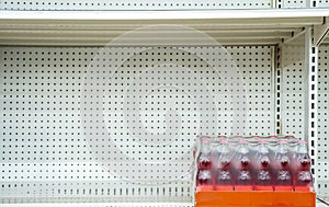 Empty sparkling water shelves in a grocery store or supermarket after fear and panic shopping because of Covid-19, Hoarding food