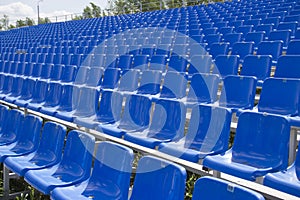Empty spectator seats in the open-air arena