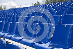 Empty spectator seats in the open-air arena
