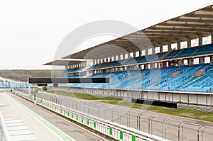 Empty speedway and bleachers on stadium