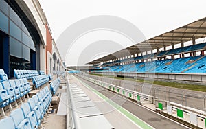 Empty speedway and bleachers on stadium