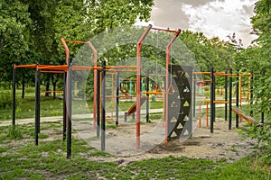 Empty sports ground with various training apparatus in the city park without people