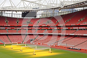 Empty sports stadium with red seats