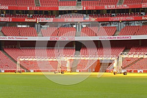 Empty sports stadium with red seats