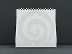 Empty square desk calendar on table. Mockup design concept. 3D