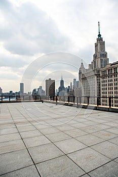 Empty square floor with skyline and buildings