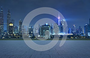 Empty square ground floor with city skyline