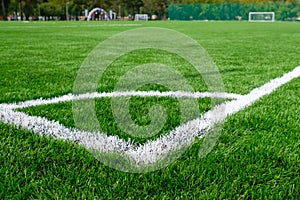 Empty stadium with artificial football pitch