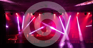 Empty stage concert with colorful lighting laser beam spotlight show in disco pub club bar background for party music dancing