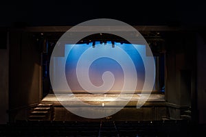 Empty Stage Lit in Blue and Yellow Lights