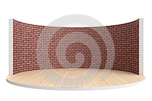 Empty stage or round room with wooden floor and red brick wall