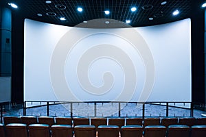 Empty stage in the small movie theater with white screen