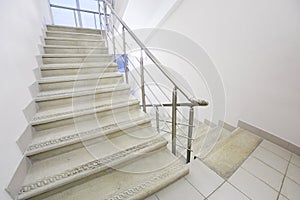 Empty staircase with metal railings photo