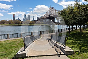 Empty Stairs along the Riverfront on Roosevelt Island with the Queensboro Bridge in New York City