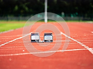 Empty Starting Blocks and red running tracks in a stadion