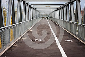 Empty steel bridge with bicycle lane