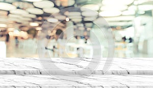 Empty step marble table top food stand with blur cafe restaurant background bokeh light,Mock up for display or montage of product