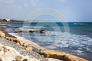 Empty stone beach on Limassol seafront on a sunny spring day
