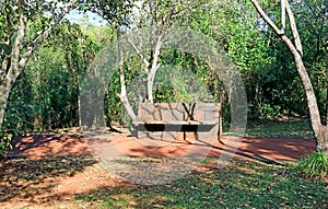 Empty Stone Bench on the Hiking Trial of Iguasu National Park, Puerto Iguazu, Argentina photo