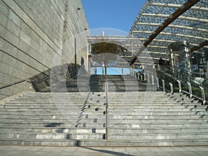 Empty stone stairs in a modern city building in morning light