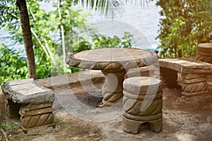 Empty stone table with brench