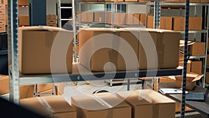 Empty storage room filled with many cardboard boxes on racks