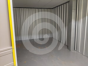 An empty self storage unit room that has been cleared photo