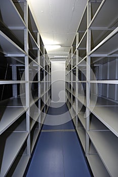 An empty storage unit with shelving