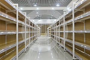 Empty shelves of supermarket interior photo