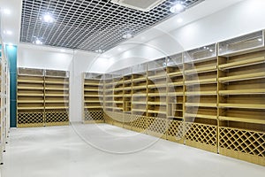 Empty store shelves of supermarket interior