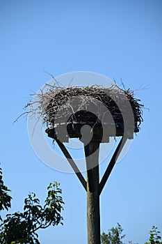 Empty storks nest blue sky