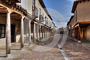 Empty street with arcade in Ampudia, Palencia, Spain