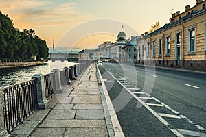 Empty street on embankment of Fontanka river embankment on sunrise. Saint Petersburg. Russia