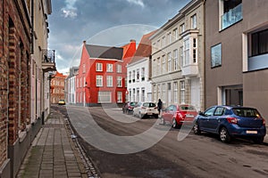 Empty Street In Old Town Of Bruges Belgium, With Red Brick Buildings A Cloudy Day. Cityscape Of Bruges Streets.