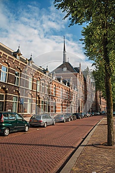 Empty street with semidetached brick houses at sunset