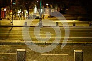 empty street and sidewalk at night