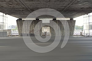 Empty street under a bridge in Riga, Latvia. Reconstruction of the bridge over highway