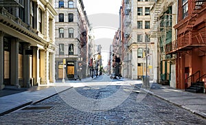 Empty streets and sidewalks of Soho are eerily quiet during the 2020 coronavirus pandemic lockdown in New York City with no people