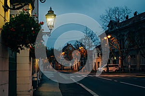 Empty streets of Zagreb, Croatia illuminated by lamps in the street during a cloudy early evening