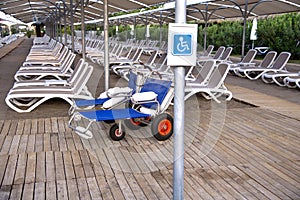 Empty  stretchers on the beach in the summer resort