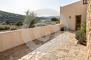 Empty Stucco Wall and Stone Floor of Mediterranean Home