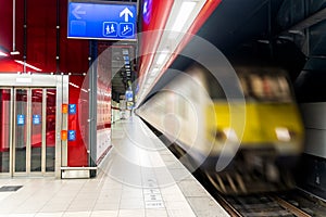 Empty subway station with speeding train, Brussels Belgium