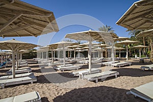 Empty sun loungers on the beach