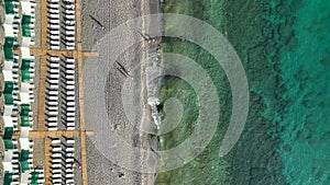 Empty sun loungers on the beach aerial view 4 K Turkey Alanya