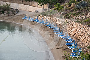 Empty sunbeds on on a beach