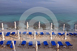 Empty sunbeds at Ionian sea on the beach in Ksamil Albania